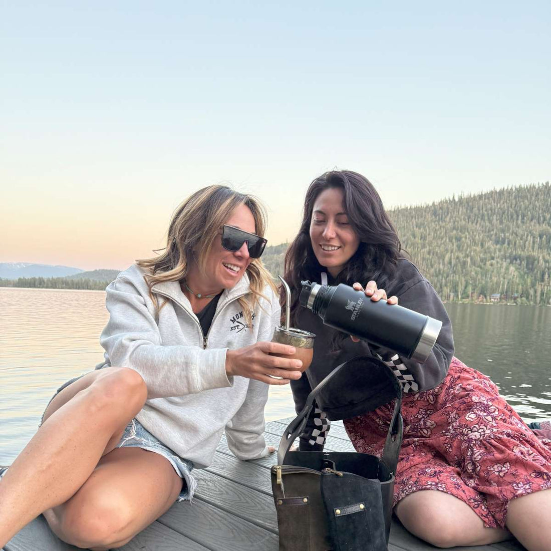 Friends sharing chimarrão from a traditional cuia