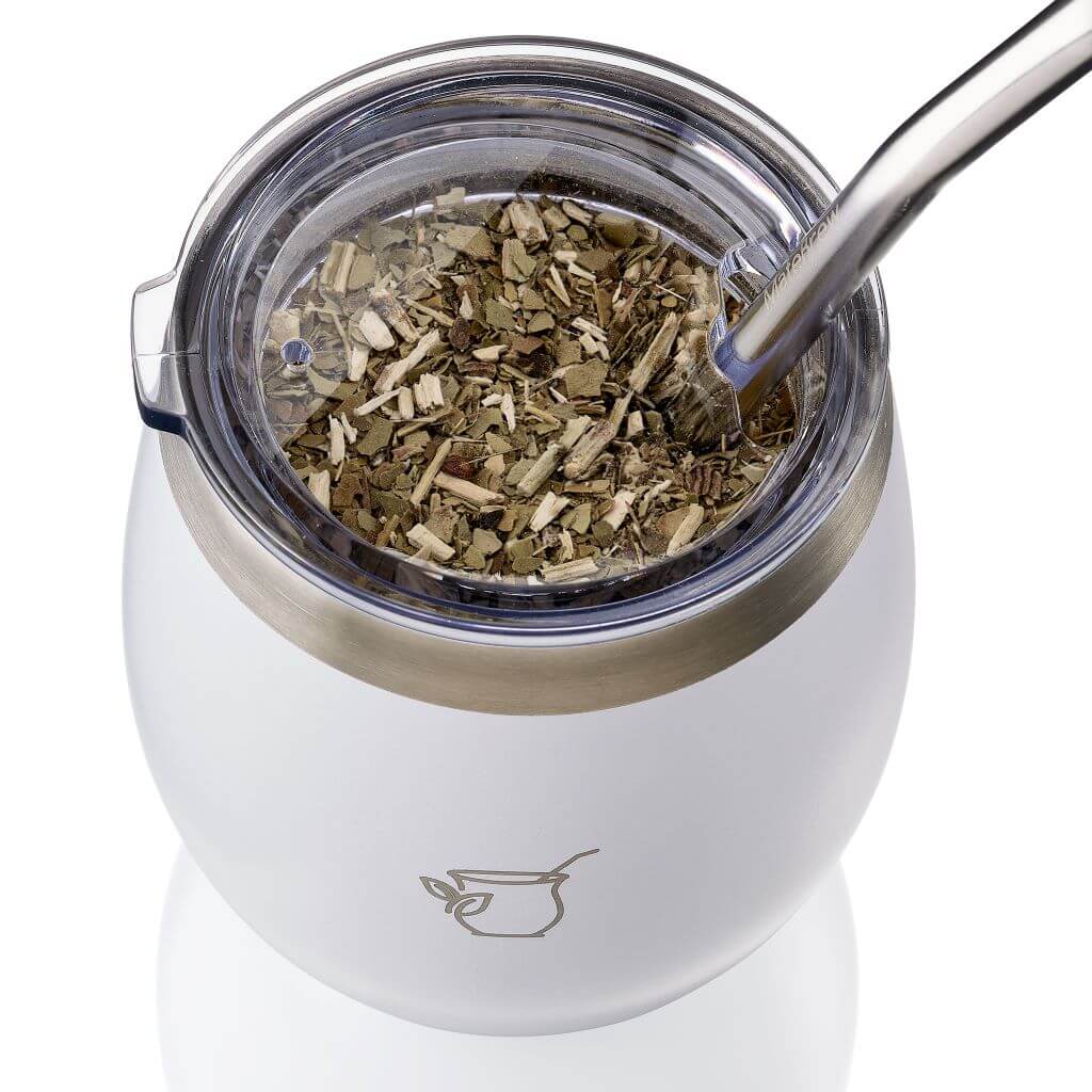 White mate cup filled with yerba mate
