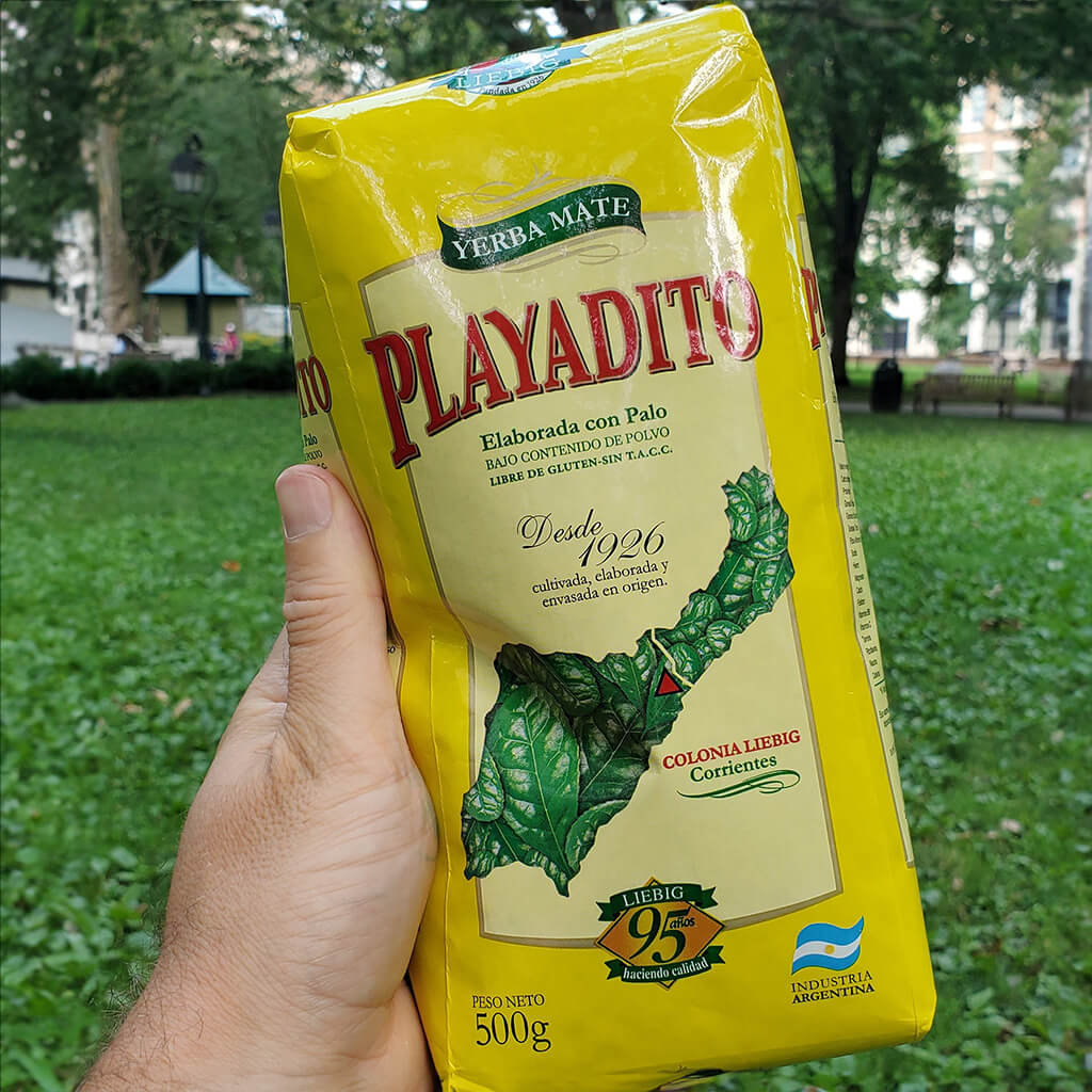 Playadito bag being held in Washington Square Park