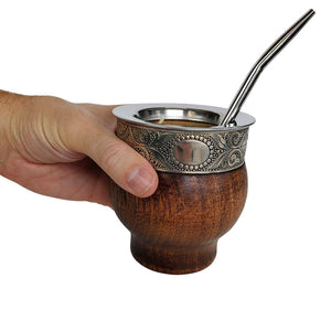 Handmade wooden mate cup in person's hand