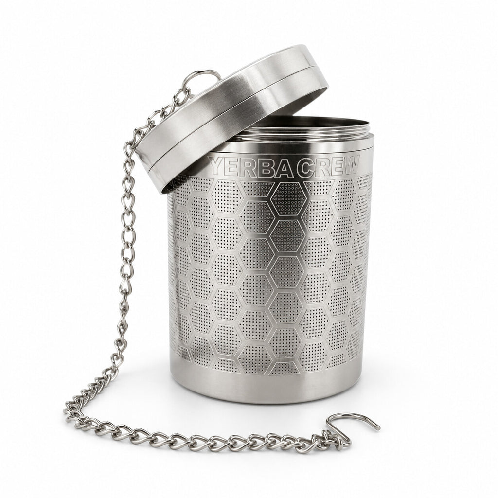 Stainless steel Ballena cold brew infuser with its lid tilted open and chain draped to the side, on a white background.