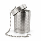 Stainless steel Ballena cold brew infuser with its lid tilted open and chain draped to the side, on a white background.