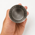 Top-down view of the Ballena infuser showing the fine mesh screen inside.