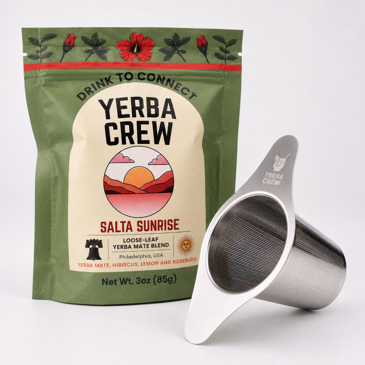 The Flamenco winged tea infuser beside a bag of Salta Sunrise hibiscus yerba mate blend.