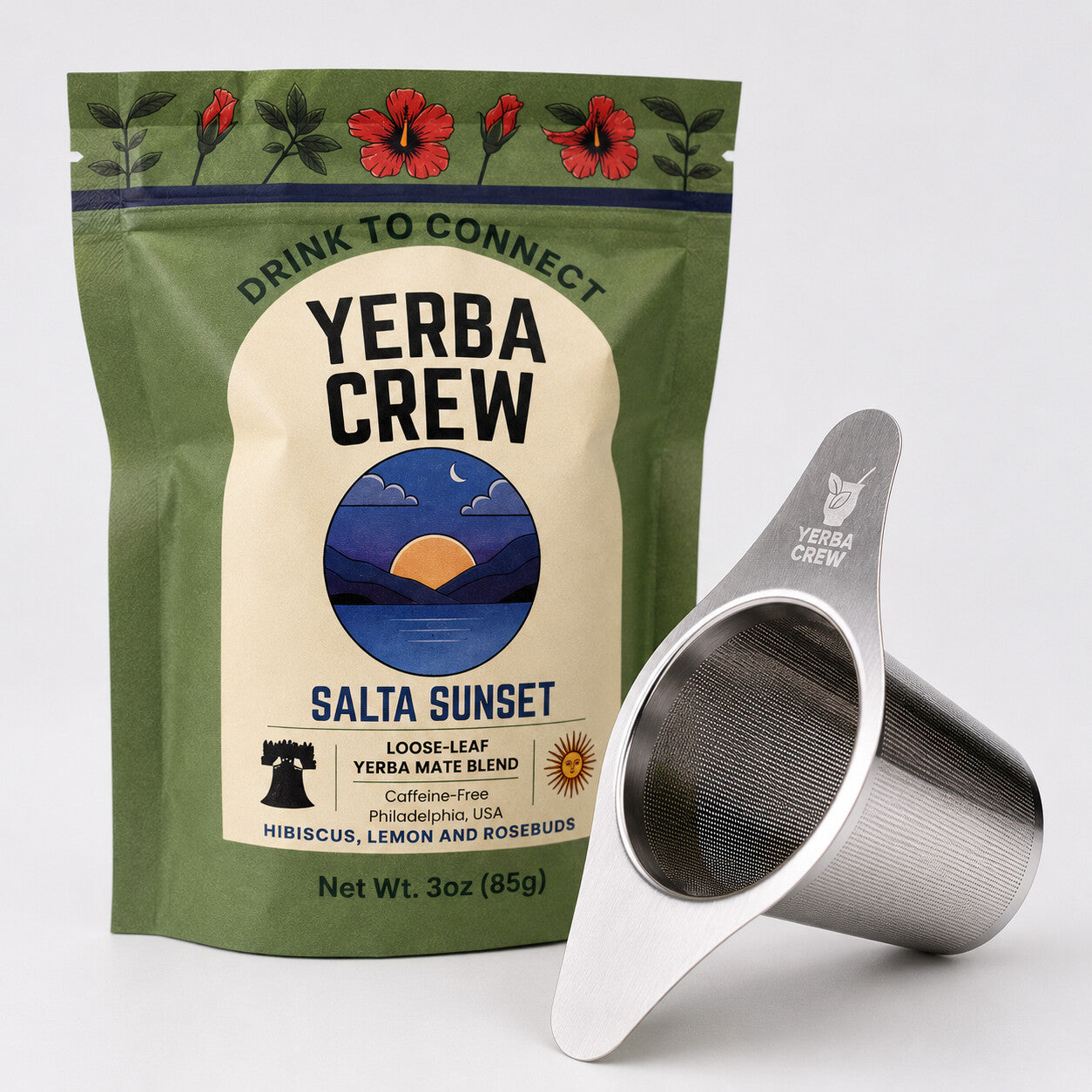 The Flamenco winged tea infuser beside a bag of Salta Sunset caffeine-free herbal blend.