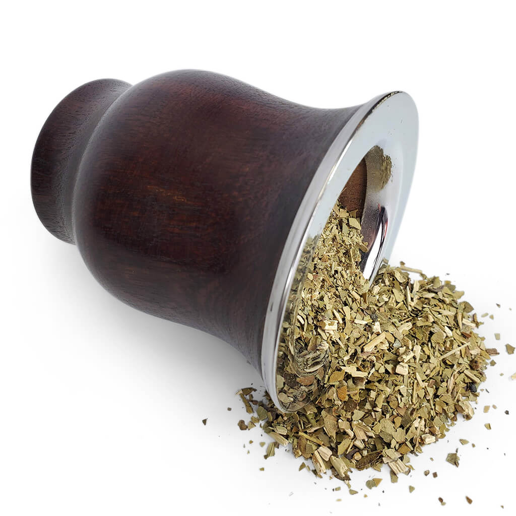 Spilled yerba mate from wooden argentine mate gourd