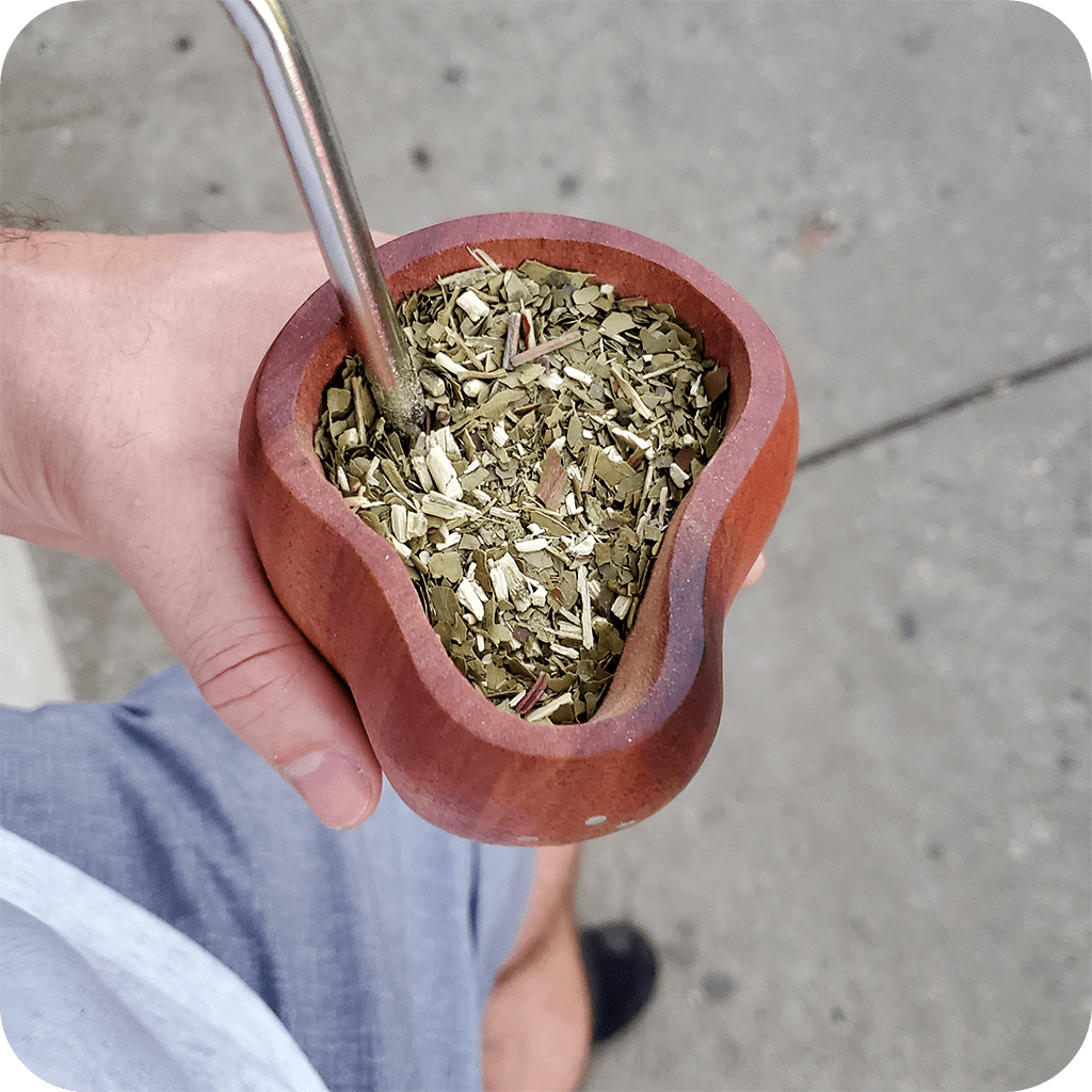 Overhead view of the unique Yerba Crew anchico wood yerba mate gourd filled with yerba and bombilla
